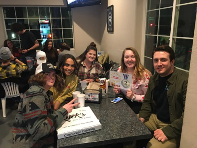 college trivia night team enjoying DJ Trivia at Rick's Pizza